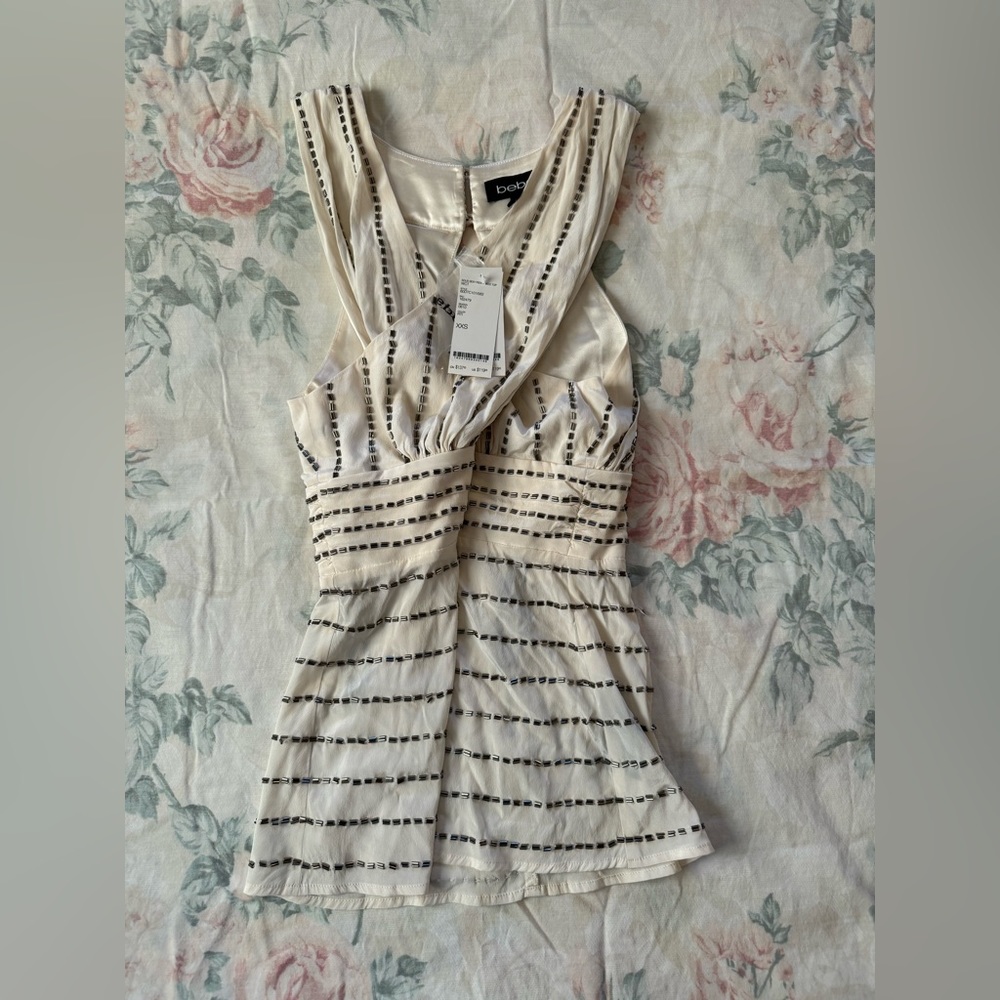 BEBE XXS white peek a boo cross front beaded top
